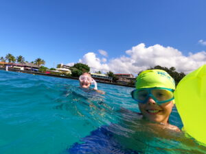 happy swimmer in kona